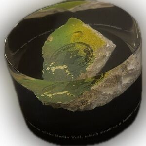 1989 Berlin Wall Remnant encased in Lucite-Paper weight. From Time Warner